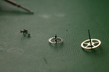 Watch movement component photographed during workshop inspection