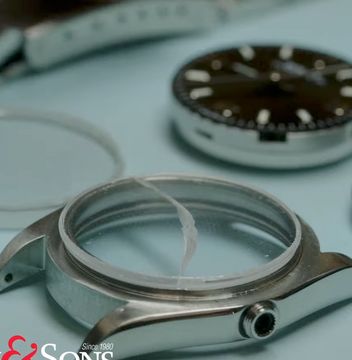 Steel watch case with a severely cracked crystal
