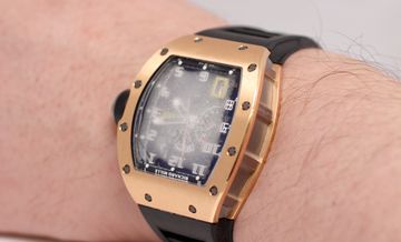 Heavy condensation visible beneath a luxury watch crystal