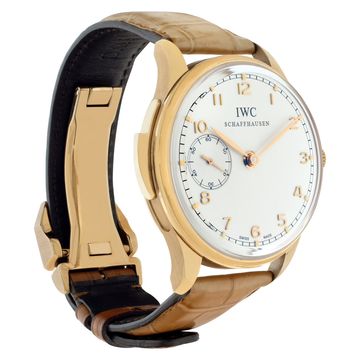 Three-quarter view of a rose-gold IWC Portugieser Minute Repeater showing the case-side repeater slide