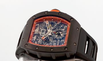Black and orange skeleton chronograph with its movement visible
