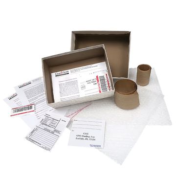 Open Gray & Sons shipping kit with a box, protective packing materials and printed forms