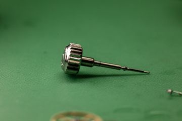 Watch crown component photographed during workshop inspection