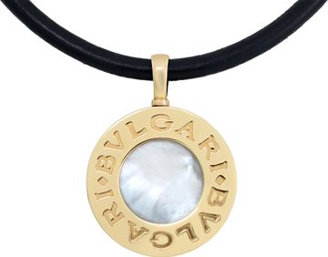 Bvlgari mother of pearl and onyx pendant in 18k and stainless steel on a black cord necklace.
