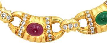 Cabochon ruby, emerald, and sapphire necklace with diamond accents, all beautifully mounted in 18k yellow gold