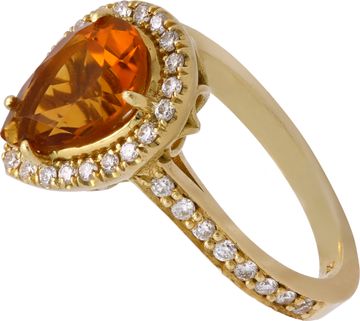 Citrine and diamond ring in 18k yellow gold with approximately 1.50 carat central pear shaped Citrine surrounded by 0.40 carats in round diamonds.