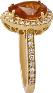 Citrine and diamond ring in 18k yellow gold with approximately 1.50 carat central pear shaped Citrine surrounded by 0.40 carats in round diamonds.