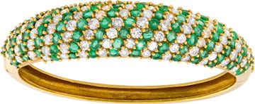 Diamond and emerald bangle in 18k yellow gold. Bracelet Collection