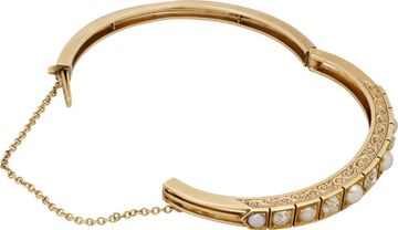 Diamond and natural pearl bangle in 14k gold