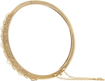 Diamond and natural pearl bangle in 14k gold