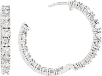Diamond hoop earrings in 14k white gold with approximately 6.7 carats in round diamonds (G-H color, VS-SI clarity). 1.25 inch diameter