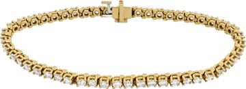 Diamond line bracelet in 14k yellow gold with over 4 carats in round diamonds (I-J color, SI clarity). Diamond line bracelet in 14k yellow gold with over 4 carats in round diamonds (I-J color, SI clarity).