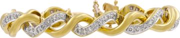 Elegant twisted bracelet in 18k yellow and white gold featuring over 2.50