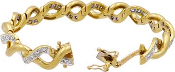 Elegant twisted bracelet in 18k yellow and white gold featuring over 2.50