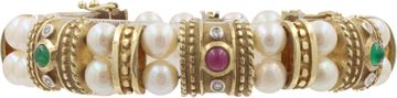 Cabochon ruby, sapphire, and emerald bracelet in 14k yellow gold with pearls