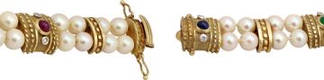 Cabochon ruby, sapphire, and emerald bracelet in 14k yellow gold with pearls