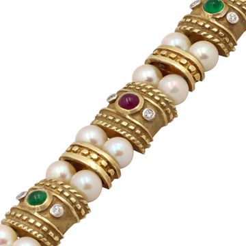 Cabochon ruby, sapphire, and emerald bracelet in 14k yellow gold with pearls