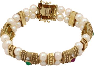 Cabochon ruby, sapphire, and emerald bracelet in 14k yellow gold with pearls