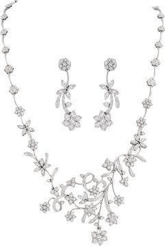 Floral cluster diamond necklace and earrings in 18k white gold Illusion set