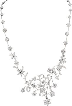 Floral cluster diamond necklace and earrings in 18k white gold Illusion set