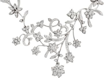 Floral cluster diamond necklace and earrings in 18k white gold Illusion set