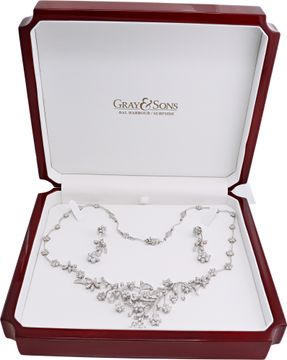 Floral cluster diamond necklace and earrings in 18k white gold Illusion set