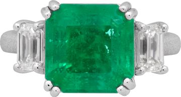 GIA Certified Emerald and diamond ring in platinum. 4.04 carat emerald with 0.79 cts in side diamonds.
