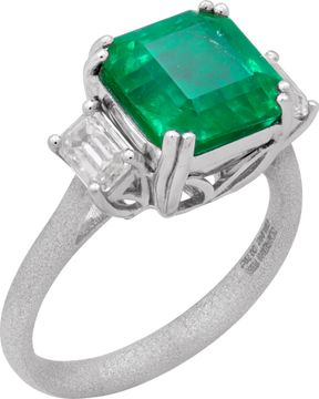 GIA Certified Emerald and diamond ring in platinum. 4.04 carat emerald with 0.79 cts in side diamonds.