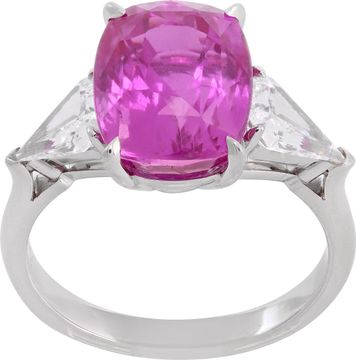 GIA Certified pink sapphire and diamond ring in platinum. 7.04 carat cushion cut pink sapphire (heated) and 0.96 carats in side kite cut diamonds (E-F color, VS1 clarity).