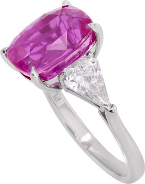 GIA Certified pink sapphire and diamond ring in platinum. 7.04 carat cushion cut pink sapphire (heated) and 0.96 carats in side kite cut diamonds (E-F color, VS1 clarity).