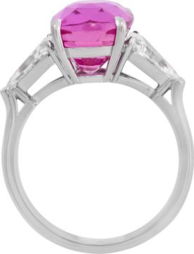 GIA Certified pink sapphire and diamond ring in platinum. 7.04 carat cushion cut pink sapphire (heated) and 0.96 carats in side kite cut diamonds (E-F color, VS1 clarity).