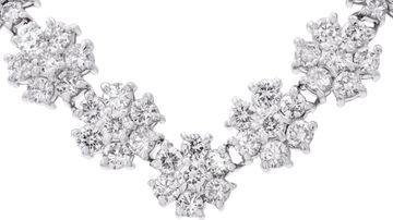 Platinum 6.00 carats diamonds graduating flower line necklace.