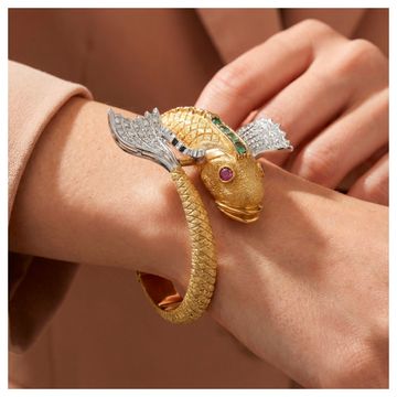 Koi Fish bangle in 18k yellow gold with 1 carat in diamonds.