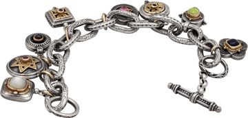 Charm Bracelet in sterling silver and 18k yellow gold.