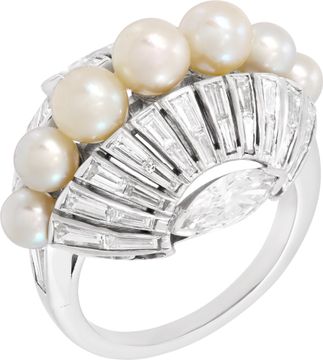 Oval diamond and pearl ring set in platinum