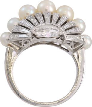 Oval diamond and pearl ring set in platinum