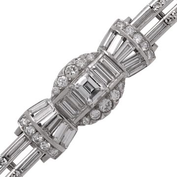 Platinum bracelet set with round, emerald, tapered baguette, and baguette-cut diamonds totaling approximately 5.00 carats