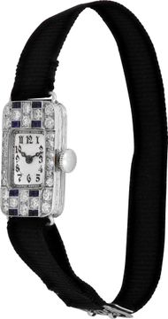 Platinum cocktail watch with diamonds and blue sapphires