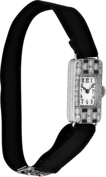 Platinum cocktail watch with diamonds and blue sapphires