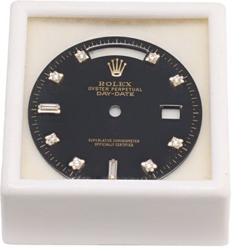 REFINISHED Rolex Day Date Black Dial with round diamond hour markers around the dial and two baguette diamonds at the 6 and 9 o'clock. This is an original Rolex diamond dial that has been refinished.