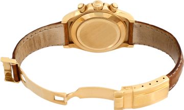 Rolex Daytona in 18k yellow gold on a brown alligator strap