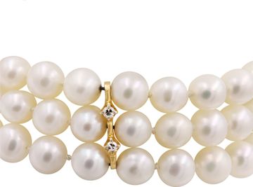Three-row cultured pearl bracelet with 14k gold clasp.