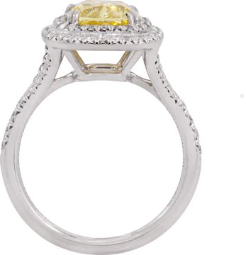 Tiffany & Co. 2.51 carat Fancy Vivid Yellow Halo Ring in 18k gold and platinum. Diamond is 2.51 carats and is VS2 clarity.