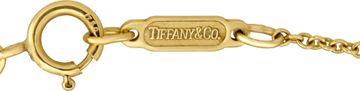 Tiffany & Co diamond small heart pendant in 18k yellow gold with approximately 0.80 carats in round diamonds.